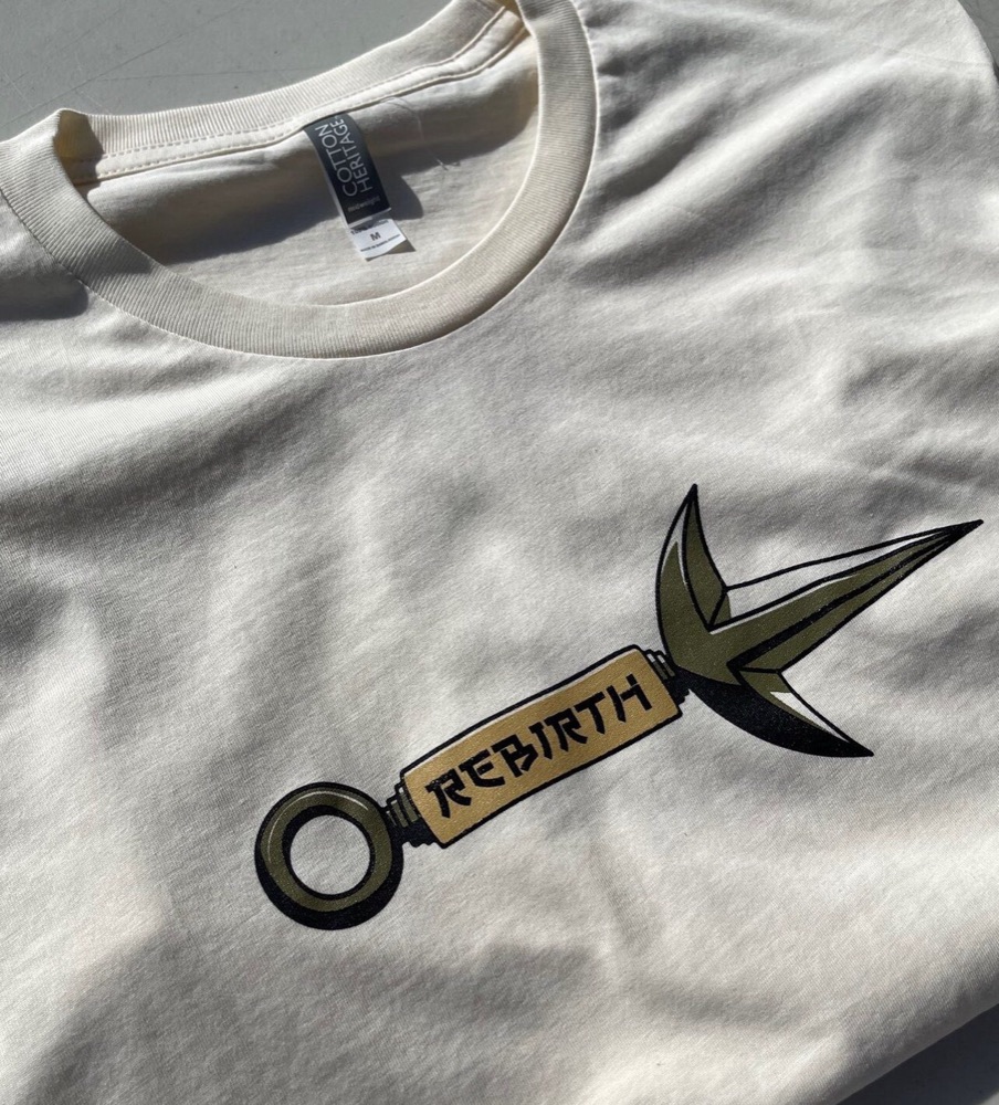 Cream tee with a printed kunai graphic